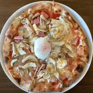 Bacon, mushroom and soft-boiled egg pizza