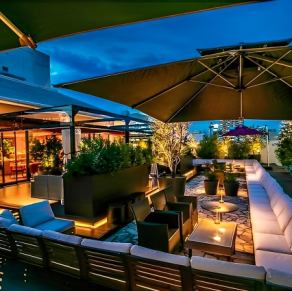 The illuminated terrace seats create a fantastical space.