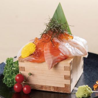 Bowl of rice topped with sashimi