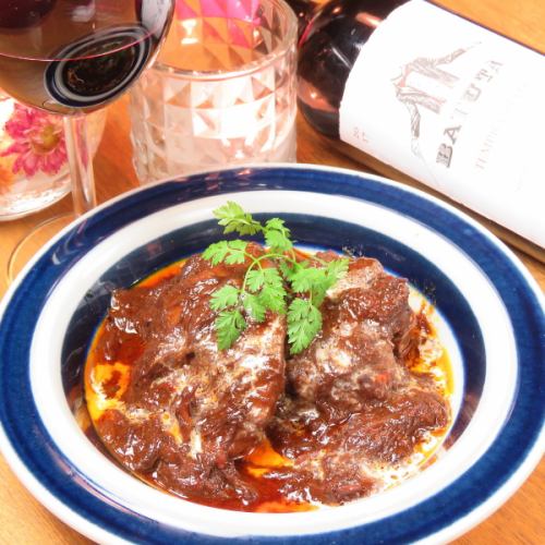 Domestic chicken stewed in red wine demi-glace sauce