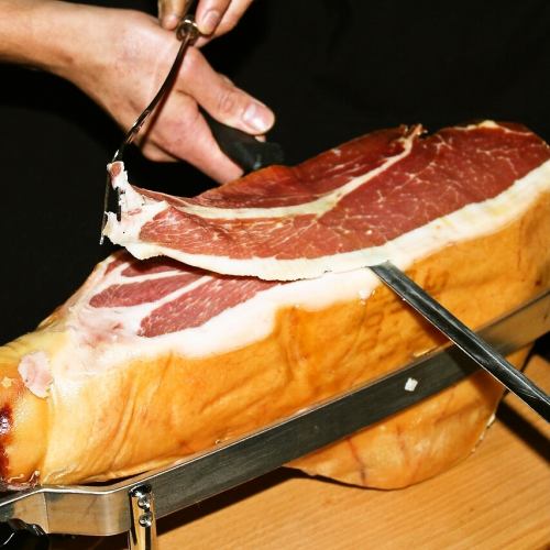 Prosciutto ham cut from Spanish logs