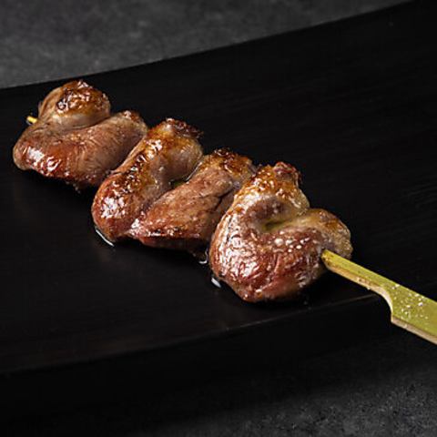 Handmade skewers of chicken hearts