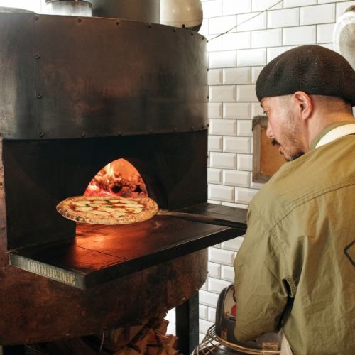 Authentic pizza baked in a wood-fired oven