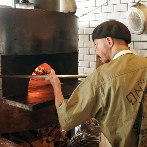 Authentic pizza baked in a wood-burning oven