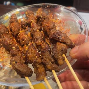 2 skewered spiced lamb