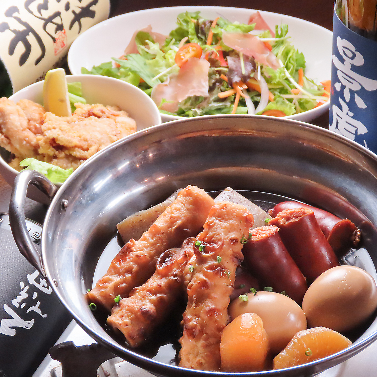 We offer a wide variety of dishes, including oden, spicy hot pot, and spicy pork shabu-shabu with green onions!