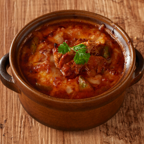 Okuno Farm's beef stewed with spicy tendons and oven-baked cheddar cheese