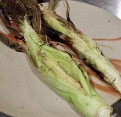 Thinned corn with husk and anchovy butter sauce