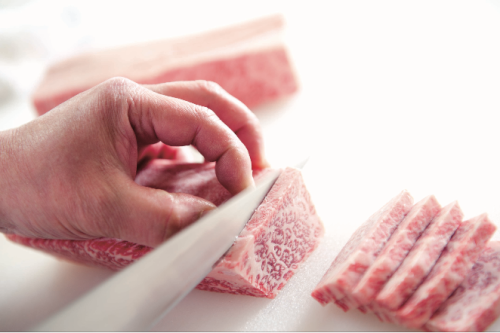 Professionals carefully select meat in their central kitchen