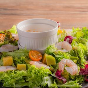 Shrimp, avocado and colorful tomato salad