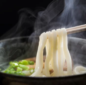 The blissful "Ontamago Niku Bukkake Udon" features slowly simmered beef and a soft, soft-boiled egg intertwined with the noodles.