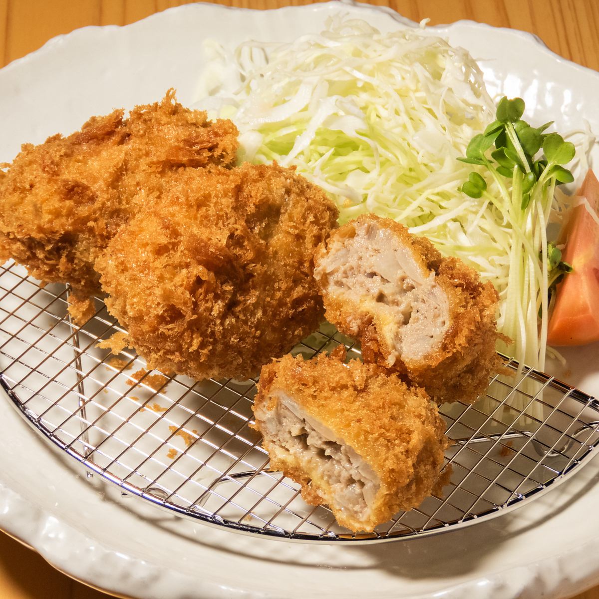 Our proud pork cutlet has a crispy batter and moist meat inside.