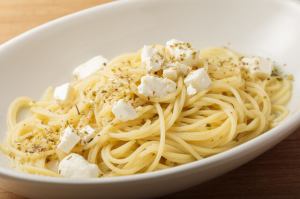 Spaghetti with feta cheese and salted lemon