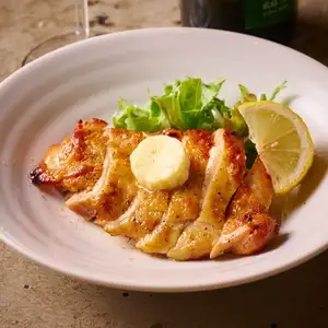 Young chicken marinated in lemon and roasted