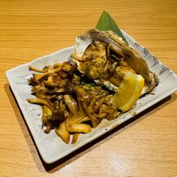 Oysters and mushrooms grilled in butter