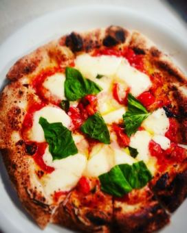 Margherita with tomatoes, basils and mozzarella cheese