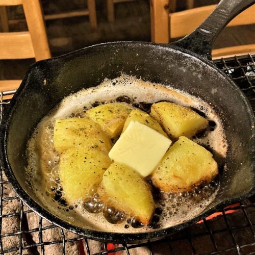 Grilled potato butter on an iron plate