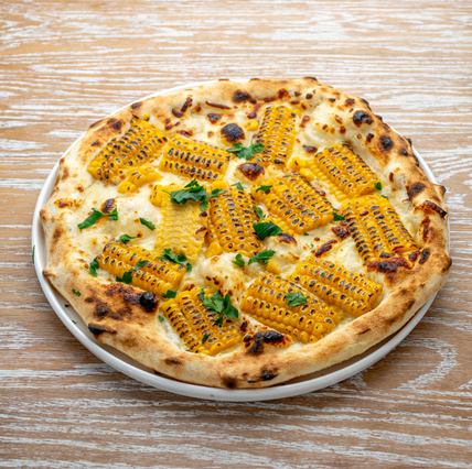 コーンまみれの黄色いピッツァ