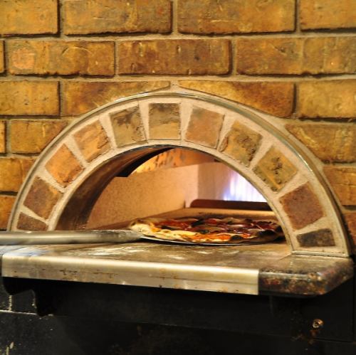 Authentic pizza baked in a stone oven