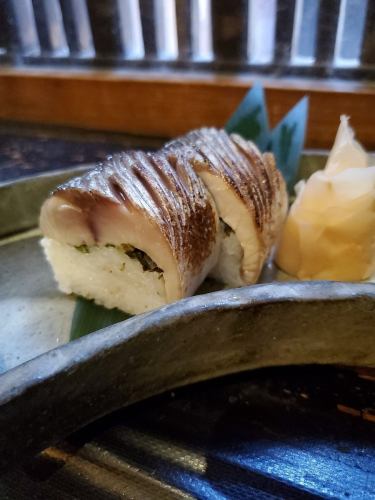 Grilled mackerel sushi, two pieces