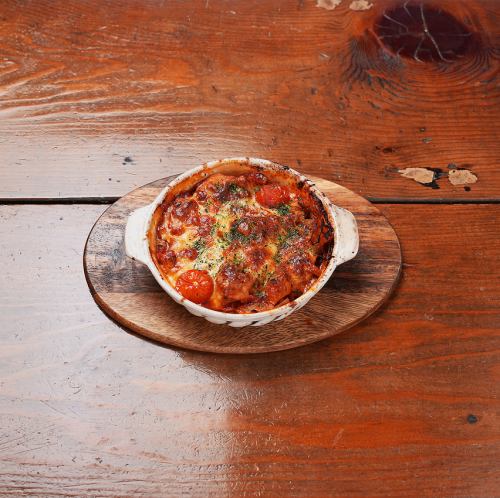 Tripe baked with tomato and cheese