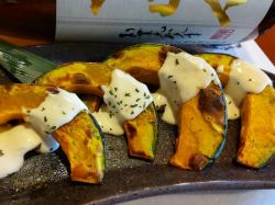 Baked pumpkin with cheese sauce