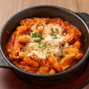 Tripe and white beans stewed in tomato sauce