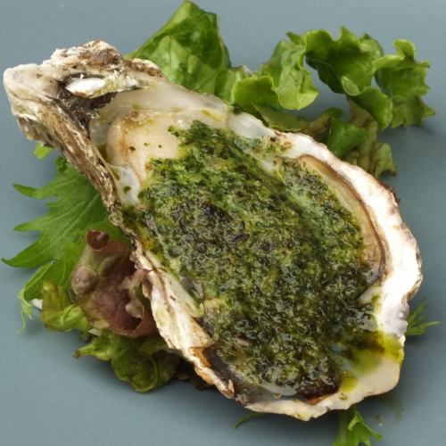 Grilled oysters with basil sauce