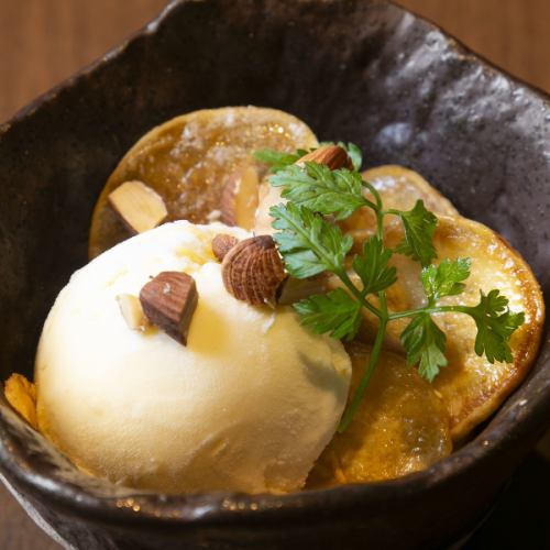 Freshly fried potato chips served with vanilla ice cream