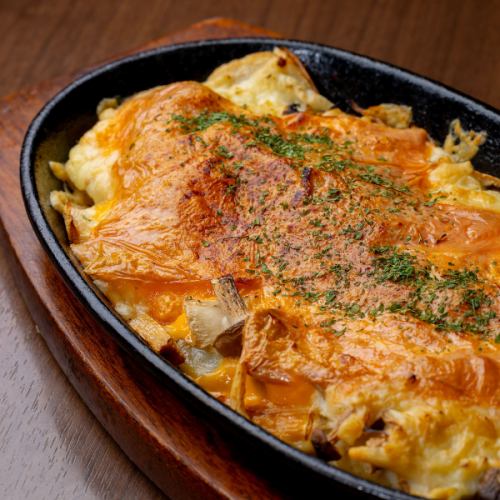 Oven baked potatoes and mushrooms with cheese