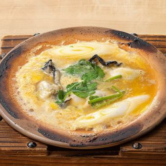 Oysters and egg simmered