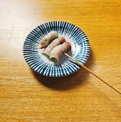 Snap peas wrapped in pork belly