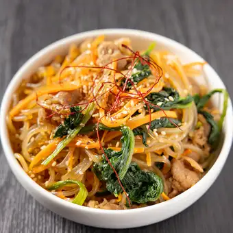 Beef and vegetable japchae with sauce
