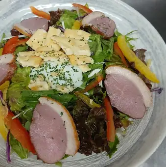 Caesar salad with duck and soft-boiled egg
