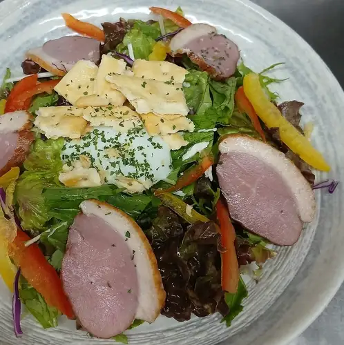 Caesar salad with duck and soft-boiled egg