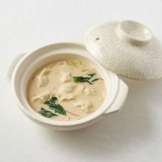 White sesame soy milk soup water dumpling pot