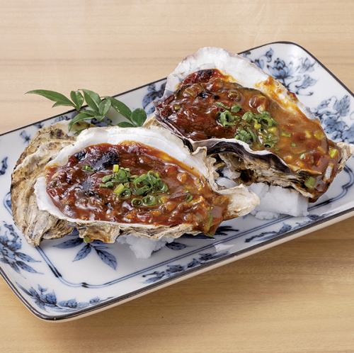 Oysters in shell, grilled with green onion and miso