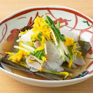 Sea bream cured with kelp and mizuna greens with chrysanthemum dressing
