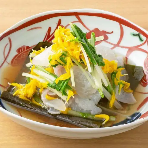 Sea bream cured with kelp and mizuna greens with chrysanthemum dressing