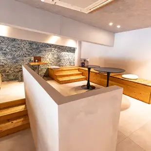 At the top of the stairs, you'll find private table seating.2-seater x 1, 4-seater x 1