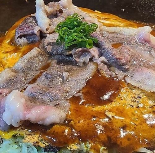 Hiroshima-style okonomiyaki, meat ball soba noodles, topped with koune meat