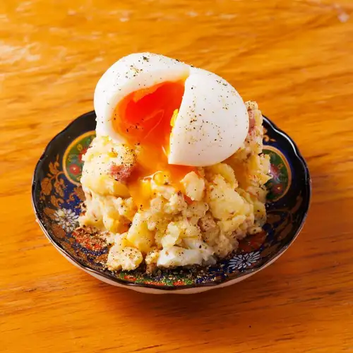 Potato salad with soft-boiled egg, pub style