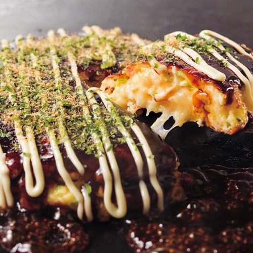 Freshly made fluffy okonomiyaki baked right in front of you