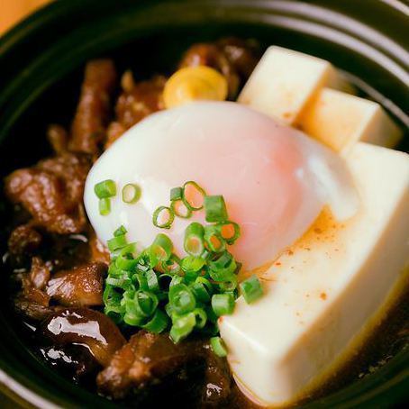 Braised beef tendon topped with warm egg