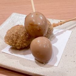 2 skewers of deep-fried quail