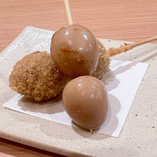 2 skewers of deep-fried quail