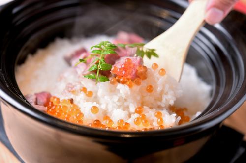 Earthenware pot rice salmon roe and meat