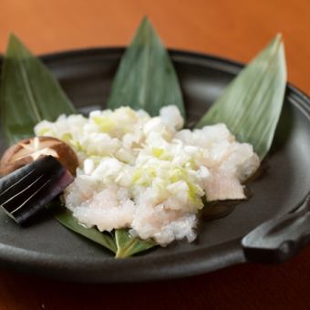 Grilled conger eel with green onion and salt on a hot plate