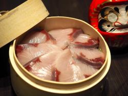 Steamed yellowtail in bamboo steamer