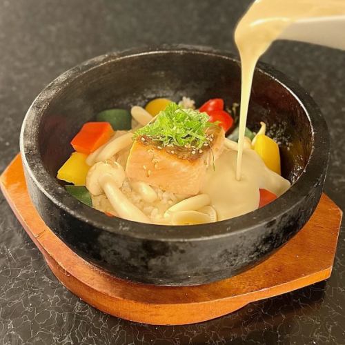Salmon and perilla leaves with soy milk cream on hot stone rice